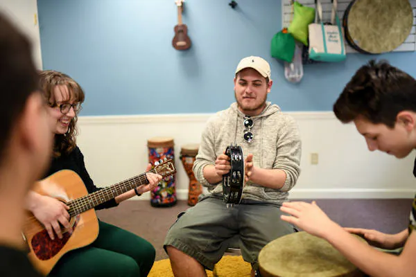 Playing instruments in music therapy group session